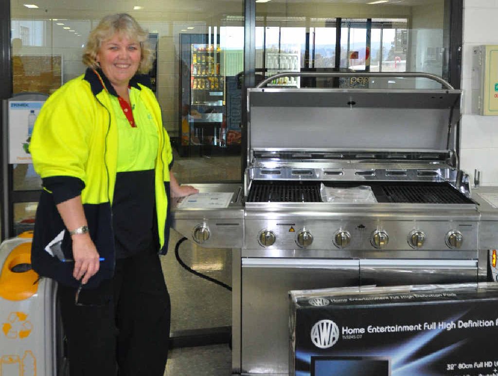 WINNERS ARE GRINNERS: Big W DC shift manager Molly Seibel with the prizes up for grabs in the charity golf day.